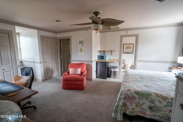 carpeted bedroom with a ceiling fan, baseboards, and ornamental molding