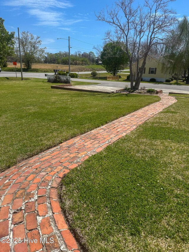 661 Main St, Swansboro, NC 28584 - view of community featuring a yard
