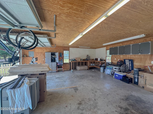 661 Main St, Swansboro, NC 28584 - garage with wood walls, wood ceiling, and a workshop area