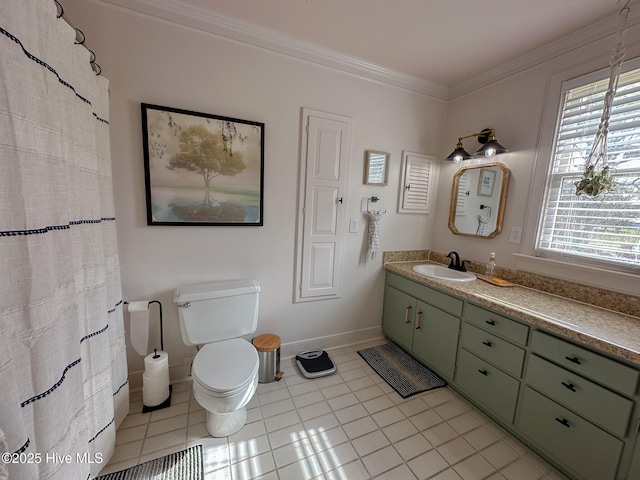 bathroom featuring crown molding, tile patterned flooring, vanity, baseboards, and toilet