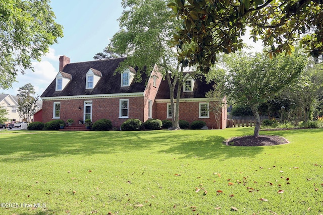 661 Main St, Swansboro, NC 28584 - cape cod house featuring brick siding and a chimney