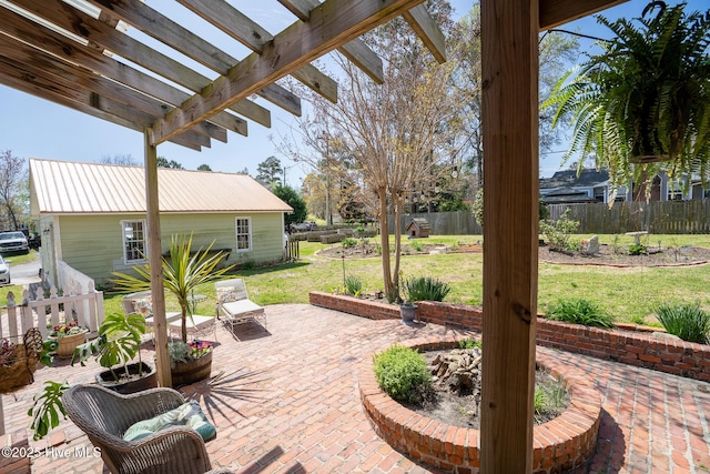 view of patio / terrace with a pergola and fence