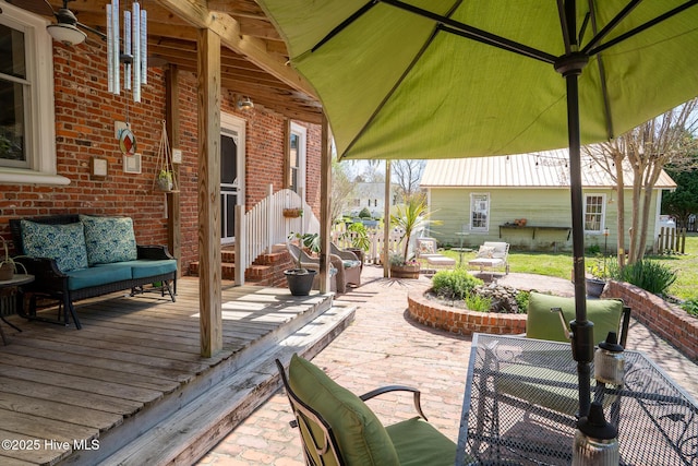 view of patio featuring a wooden deck and an outdoor hangout area