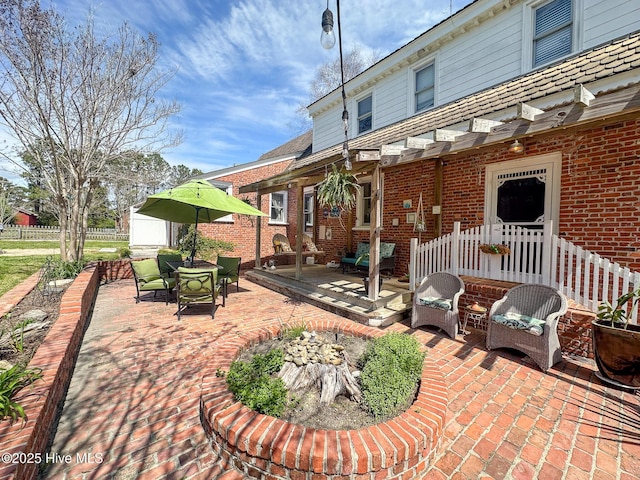 view of patio featuring fence