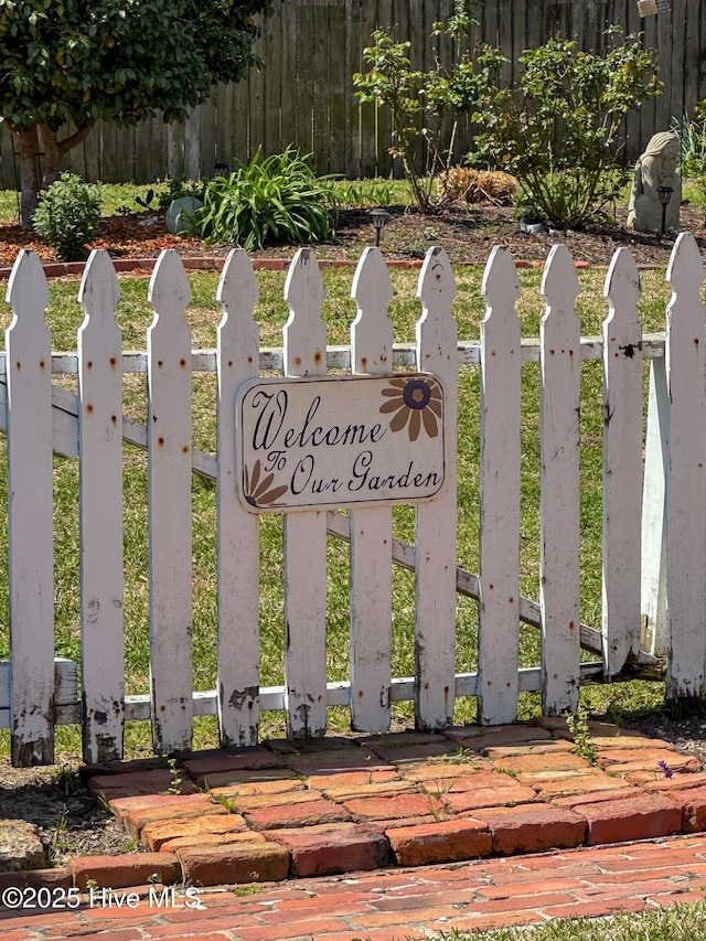 community sign with fence