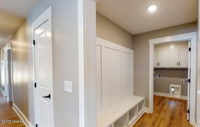 mudroom with light wood-style flooring and baseboards