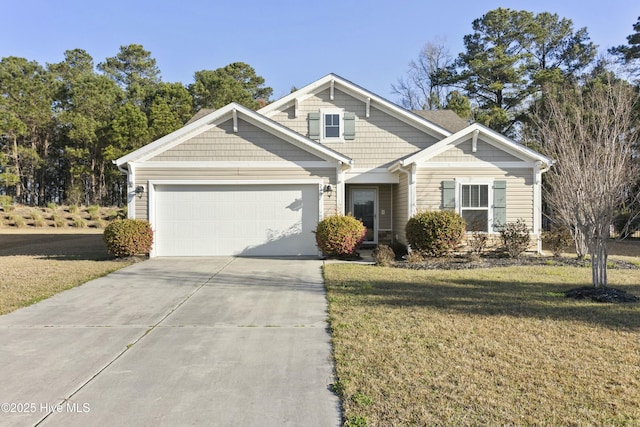 craftsman inspired home with an attached garage, driveway, and a front yard