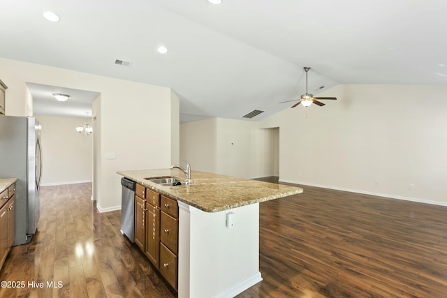 kitchen with visible vents, a sink, vaulted ceiling, appliances with stainless steel finishes, and ceiling fan with notable chandelier