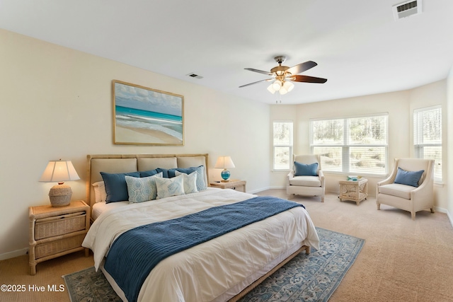 bedroom featuring baseboards, visible vents, carpet floors, and ceiling fan