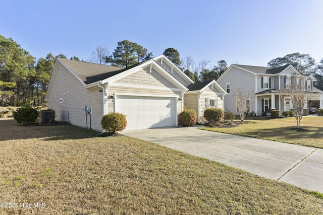 view of front facade featuring a front lawn, an attached garage, central AC unit, and driveway