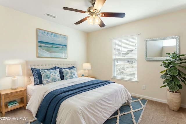 bedroom featuring visible vents, baseboards, a ceiling fan, and carpet flooring