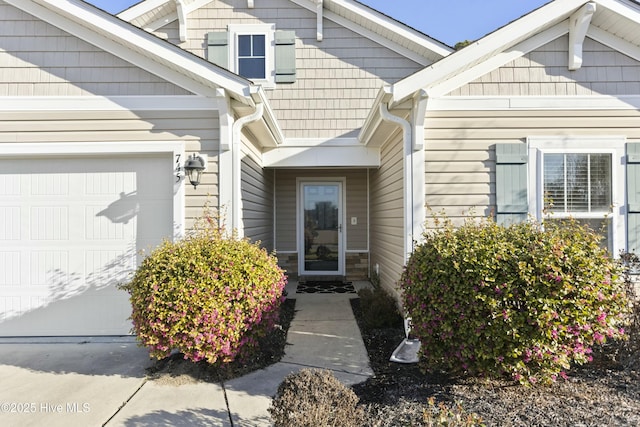 doorway to property with an attached garage