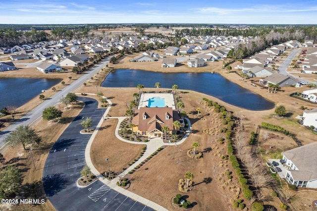 birds eye view of property with a residential view and a water view