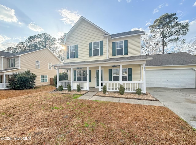 traditional-style house with a porch, concrete driveway, an attached garage, and a shingled roof