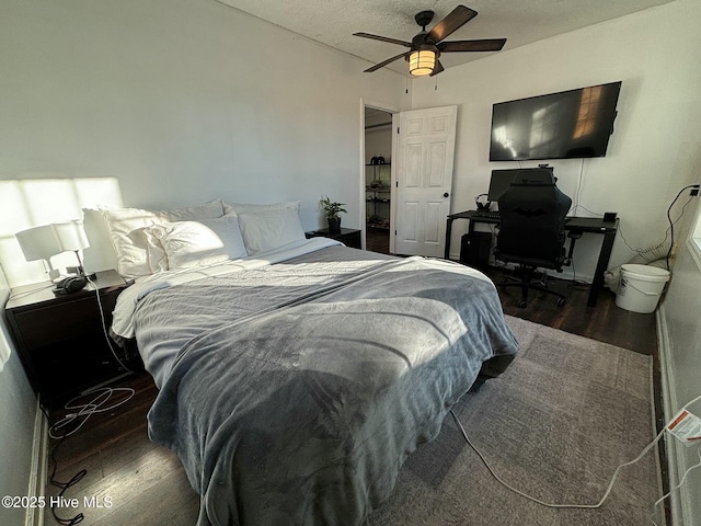 bedroom featuring a ceiling fan and wood finished floors