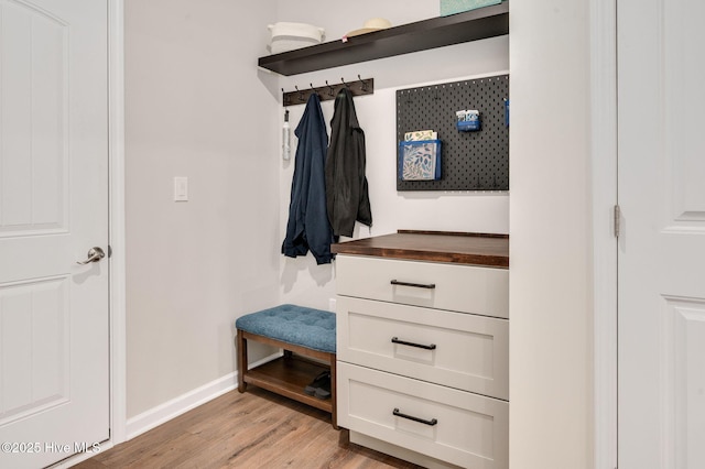 mudroom featuring light wood-type flooring and baseboards