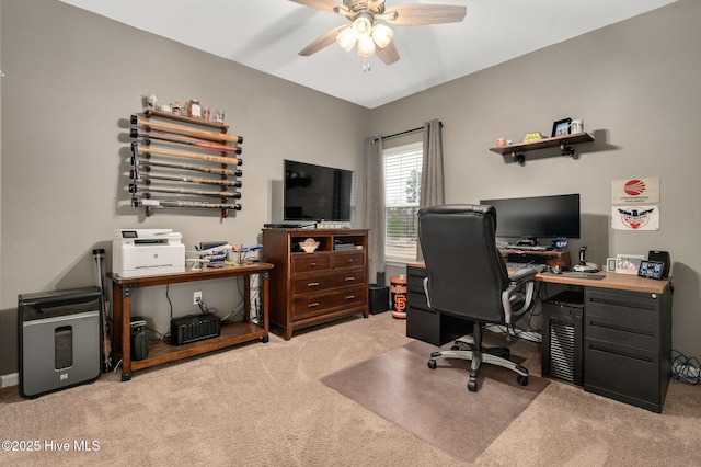 carpeted office space with ceiling fan