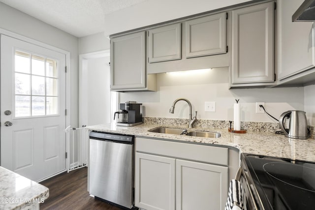 kitchen featuring range with electric cooktop, gray cabinets, a sink, stainless steel dishwasher, and a textured ceiling