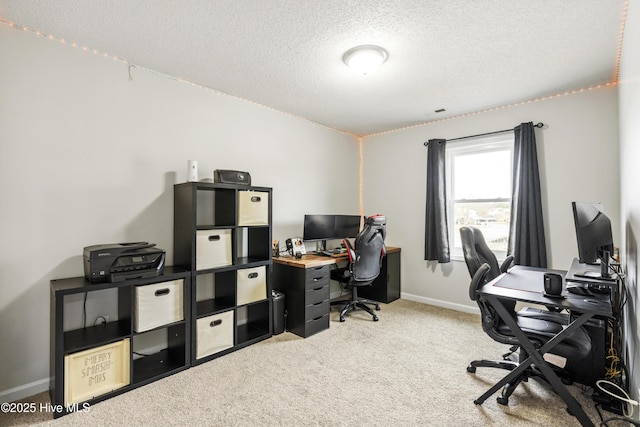 office area featuring baseboards, carpet floors, and a textured ceiling