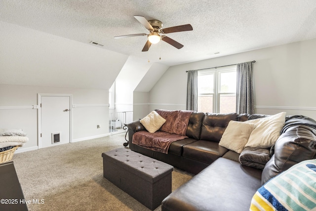 living room with visible vents, carpet floors, lofted ceiling, and a ceiling fan