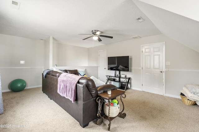 living room with a ceiling fan, visible vents, carpet floors, and baseboards