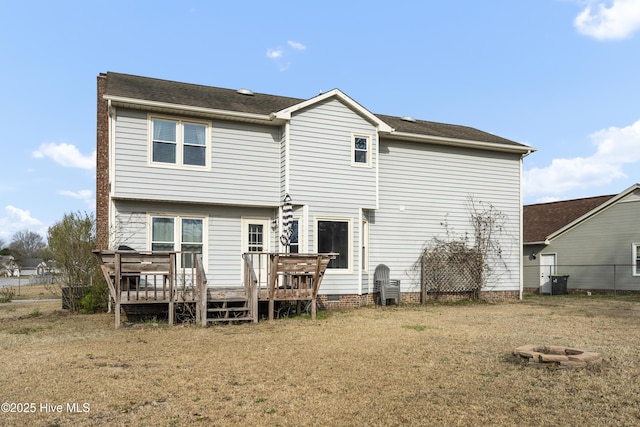 back of property featuring a wooden deck