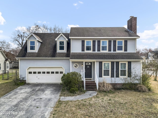 traditional home with fence, concrete driveway, a front yard, roof with shingles, and a chimney