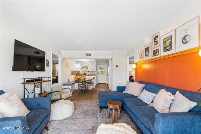 298 Ocean Blvd W # 103, Holden Beach, NC 28462 - living room featuring wood finished floors and visible vents