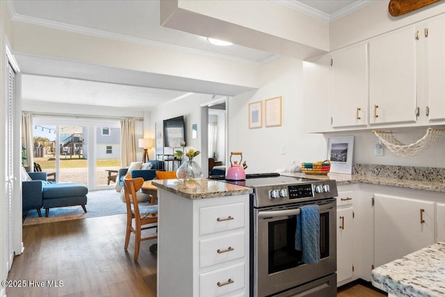 298 Ocean Blvd W # 103, Holden Beach, NC 28462 - kitchen featuring wood finished floors, a peninsula, electric stove, ornamental molding, and white cabinetry