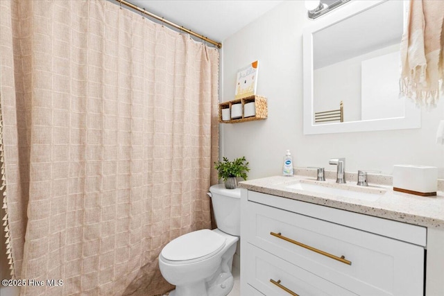 298 Ocean Blvd W # 103, Holden Beach, NC 28462 - bathroom with toilet, a shower with curtain, and vanity