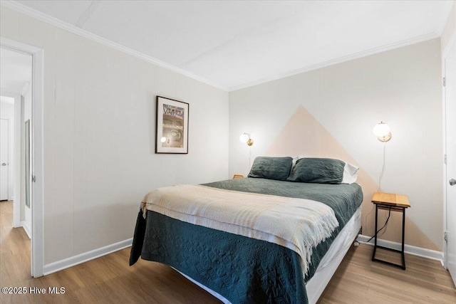 298 Ocean Blvd W # 103, Holden Beach, NC 28462 - bedroom with baseboards, ornamental molding, and wood finished floors