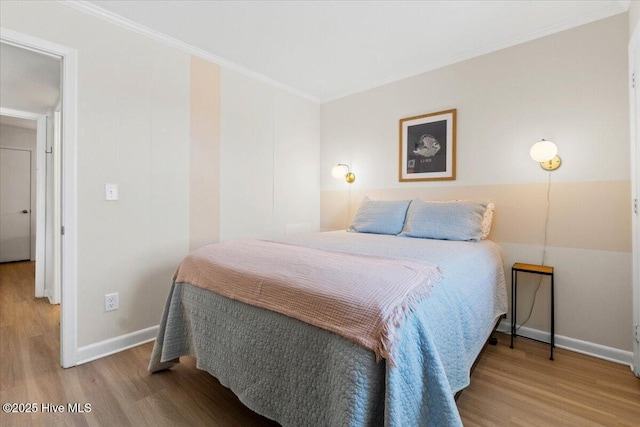 298 Ocean Blvd W # 103, Holden Beach, NC 28462 - bedroom with crown molding, baseboards, and wood finished floors