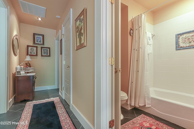 1335 Midland Rd, Southern Pines, NC 28387 - bathroom featuring toilet, tile patterned flooring, shower / bath combo with shower curtain, and baseboards
