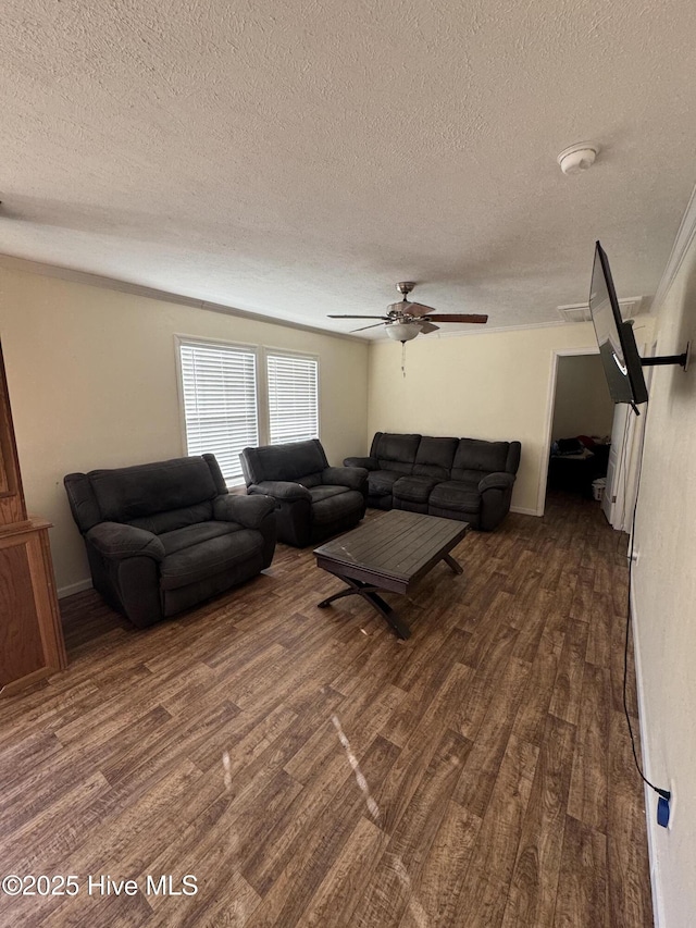 living area featuring a textured ceiling, dark wood-style flooring, and ceiling fan