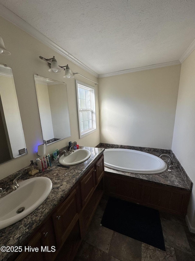 bathroom with a textured ceiling, crown molding, a bath, and a sink