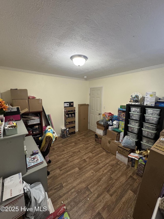 office space with a textured ceiling, wood finished floors, and ornamental molding