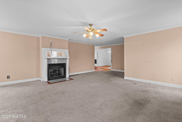 unfurnished living room with a fireplace with flush hearth, baseboards, ceiling fan, and ornamental molding