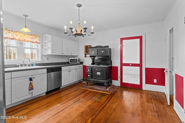 kitchen featuring a sink, open shelves, stainless steel appliances, an inviting chandelier, and white cabinets