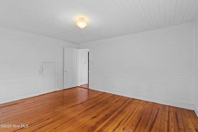 spare room with hardwood / wood-style floors