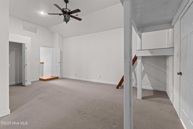 unfurnished bedroom featuring lofted ceiling, a ceiling fan, recessed lighting, carpet floors, and baseboards