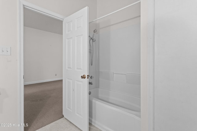 bathroom with bathing tub / shower combination