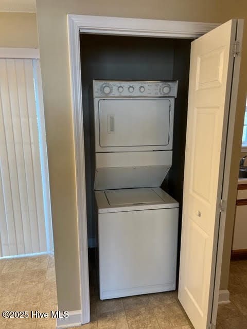 laundry area with laundry area and stacked washing maching and dryer