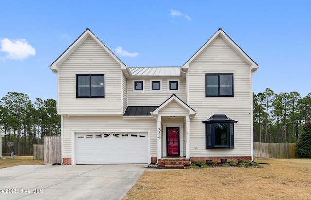 view of front facade featuring fence, a standing seam roof, concrete driveway, a garage, and metal roof