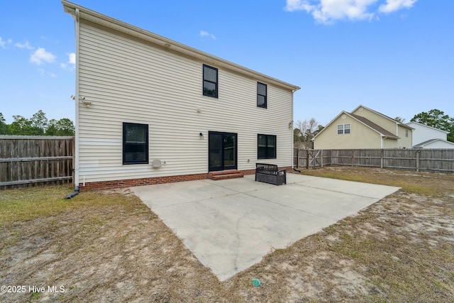 back of house with a patio area and a fenced backyard