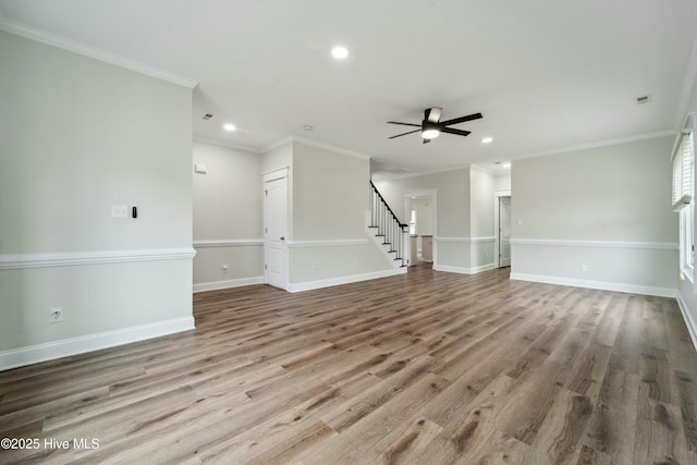 unfurnished living room featuring stairs, recessed lighting, wood finished floors, and a ceiling fan