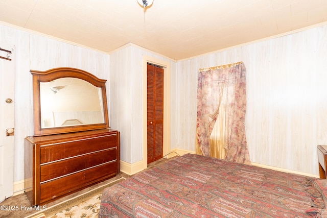 unfurnished bedroom featuring a closet and crown molding