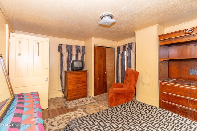 bedroom with a closet and wood finished floors