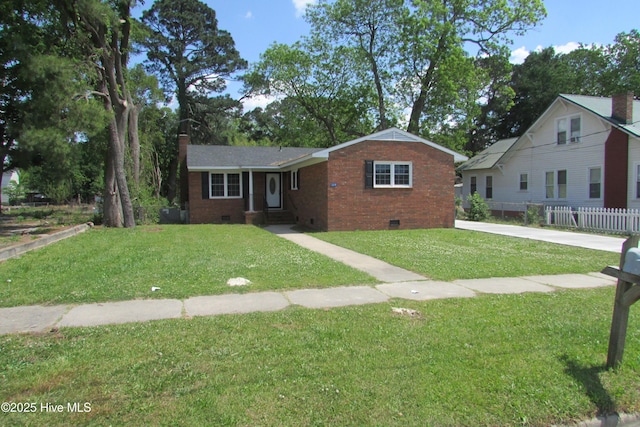 view of front facade featuring fence, a front yard, crawl space, brick siding, and a chimney