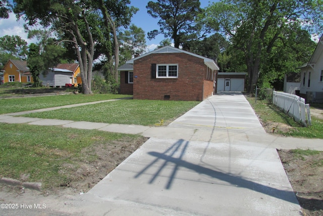 view of front of home with a front lawn, fence, concrete driveway, crawl space, and brick siding