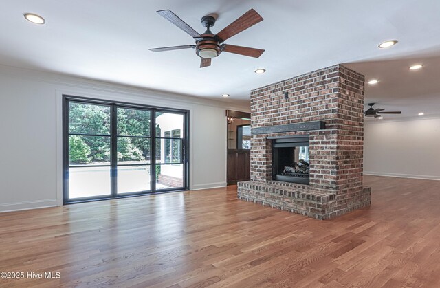 240 Donald Ross Dr, Pinehurst, NC 28374 - unfurnished living room featuring a ceiling fan, baseboards, crown molding, recessed lighting, and wood finished floors
